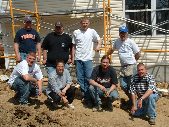 Local 212 apprentices pause for the camera while volunteering at a Habitat for Humanity project.